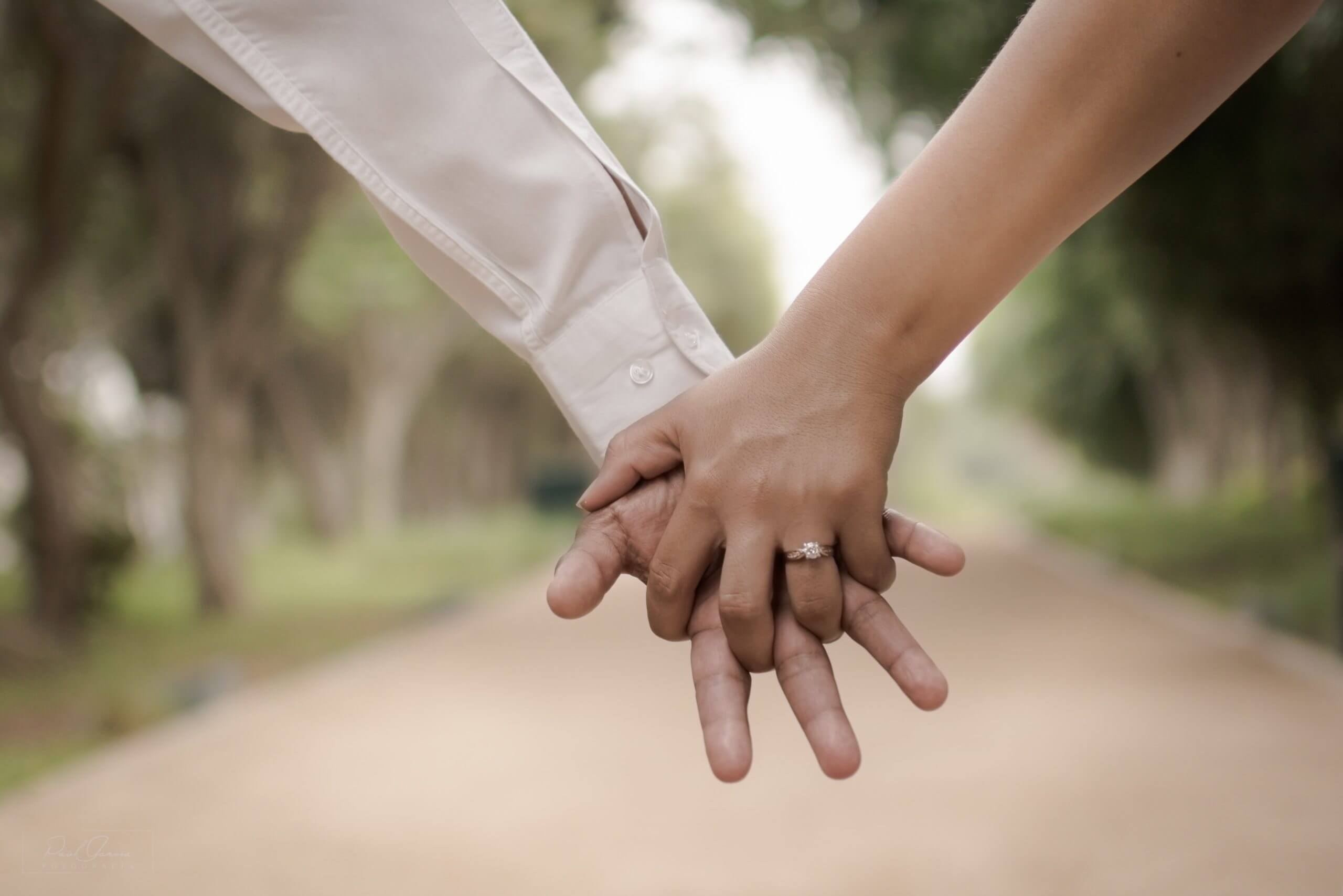 Two people holding hands|How to broach the topic of a prenup with your partner