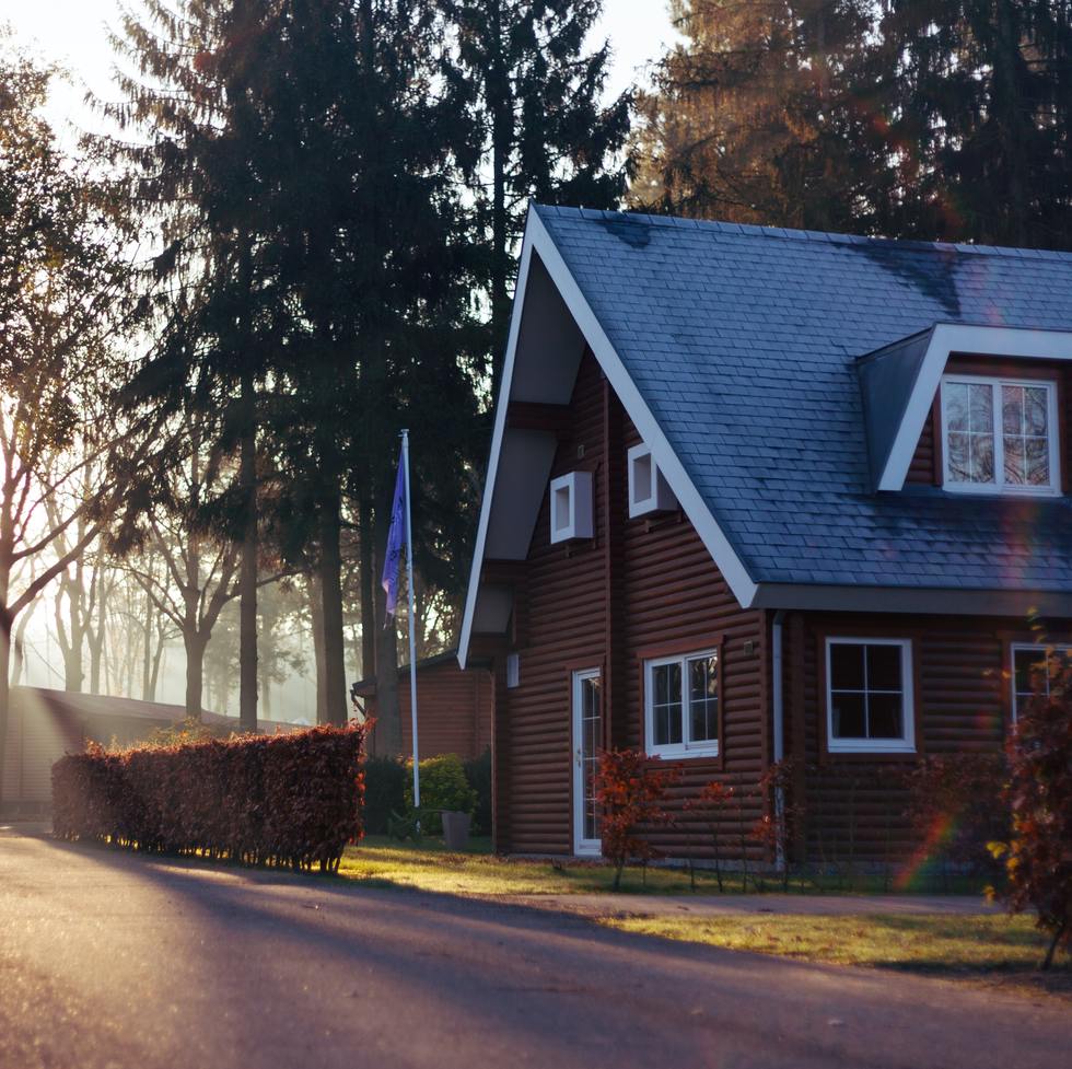 A brown house at dusk