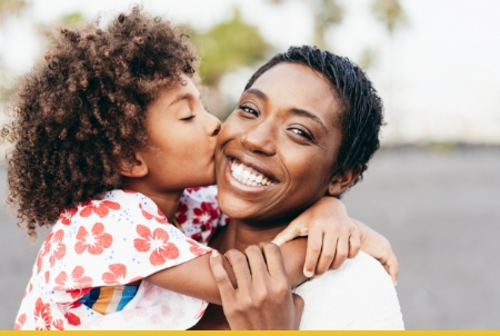 A happy mother and child sharing a loving moment outdoors