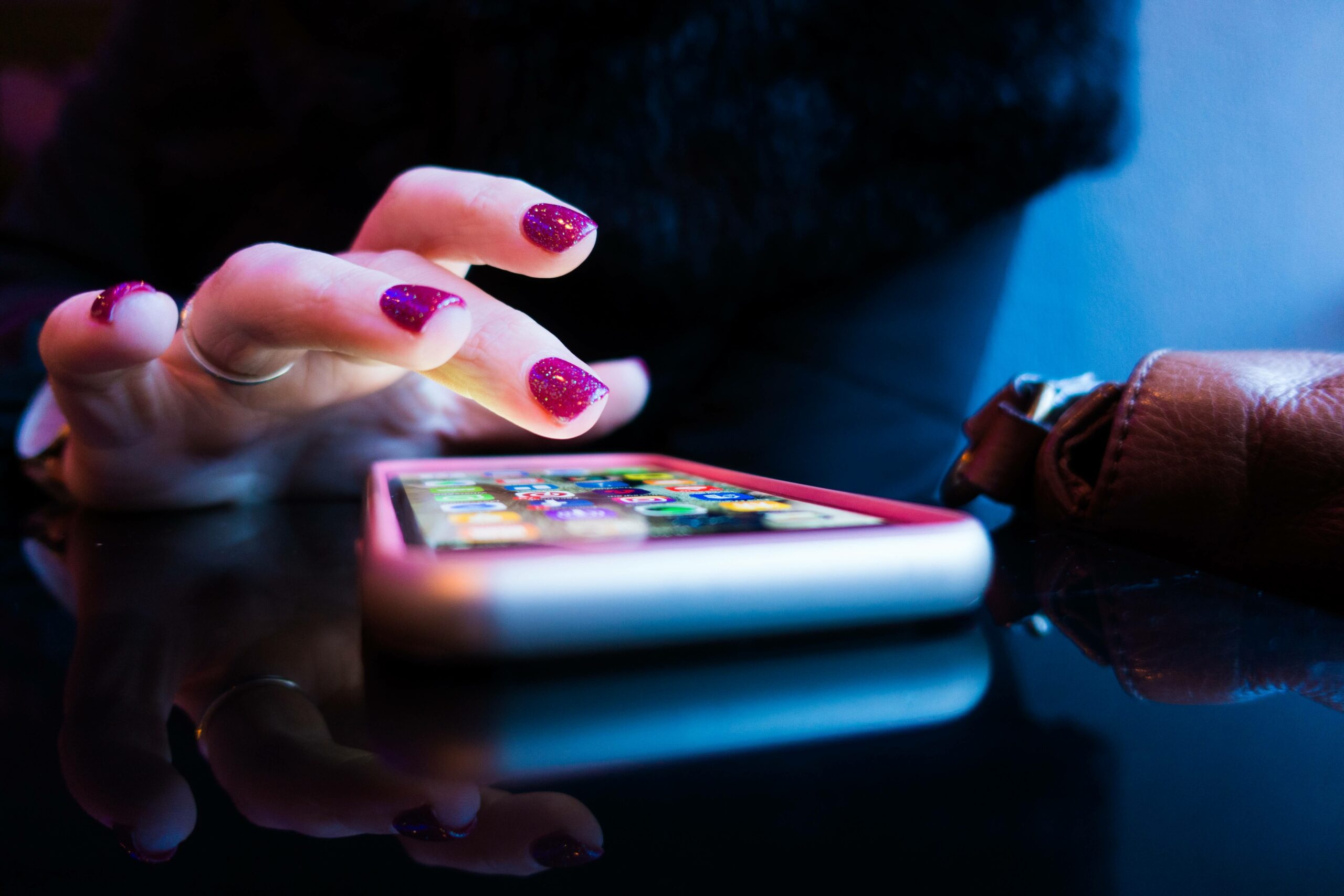 Person using phone on a flat surface
